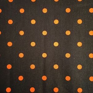 Black Fabric with Orange Polka Dot Pattern. Price Per Yard